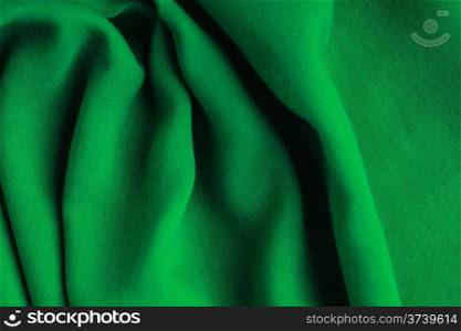 green background abstract cloth wavy folds of textile texture wallpaper design of elegant material