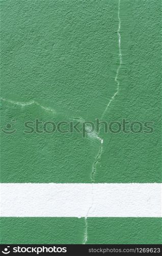 Green background. Sport wall with cracked paint. Copy space