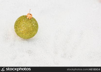 Green ball with snow for the Xmas tree decoration