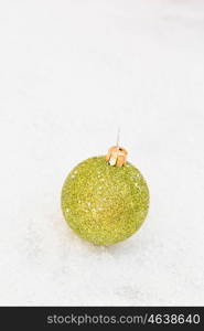 Green ball with snow for the Xmas tree decoration
