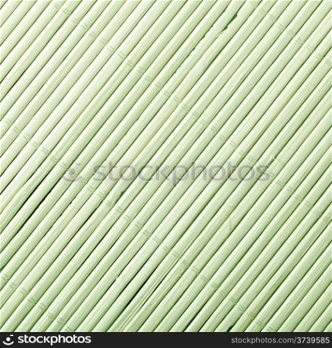 Green bamboo mat surface pattern diagonal background texture. Square format