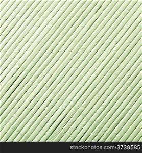 Green bamboo mat surface pattern diagonal background texture. Square format