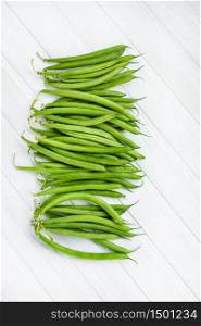 green beans on a wooden on white background. green bean for background