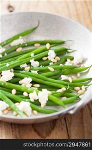 green beans salad with goat cheese and pine nuts