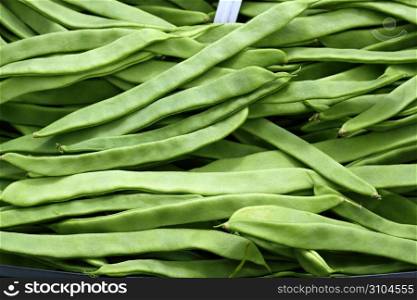 green beans vegetable texture in Spain market food background