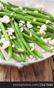 green beans with goat cheese and pine nuts