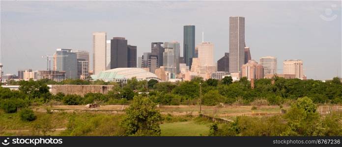 Green beltway under perfect Houston downtown city skyline