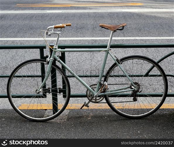 green bicycle with brown black details