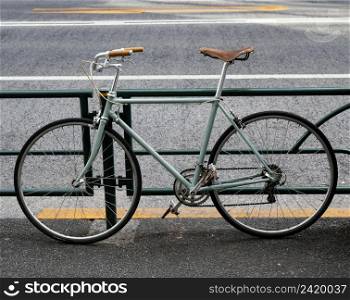 green bicycle with brown black details