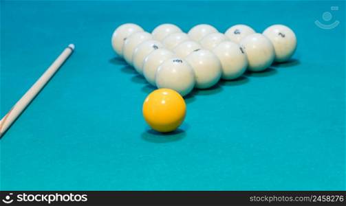 Green billiard table with white balls and cue. game of billiards