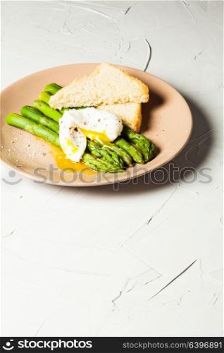 Green boiled Asparagus with Poached Egg, with salt and spices. Green boiled Asparagus