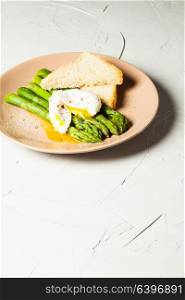 Green boiled Asparagus with Poached Egg, with salt and spices. Green boiled Asparagus