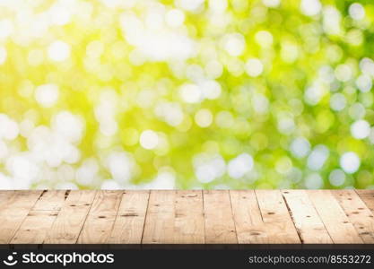 green bokeh display and wooden table background with space for product.