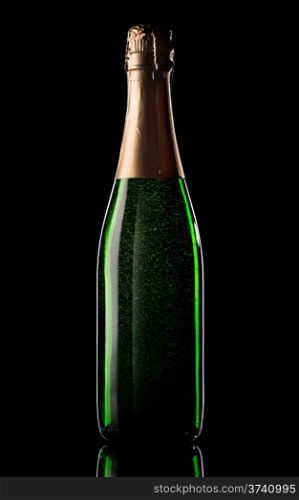Green bottle of champagne on black background