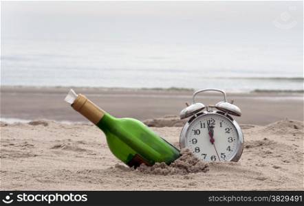 green bottle post and a clock on the beach