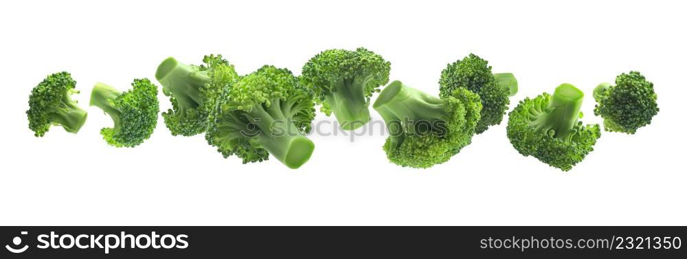 Green broccoli levitating on a white background.. Green broccoli levitating on a white background