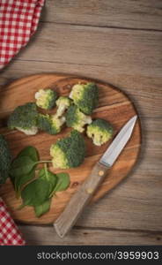 Green broccoli on wood table