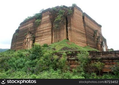 Green bush and brick stupa in Mingun, Mandalay, Myanmar