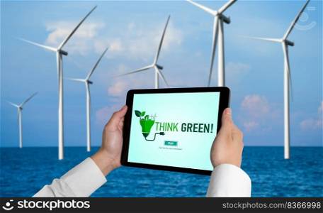 Green business transformation for environment saving and ESG business concept. Businessman using tablet to set corporate goal toward environmental friendly management and alternative clean energy use.. Green business transformation for environment saving and ESG business concept