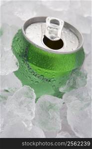 Green Can Of Fizzy Soft Drink Set In Ice With The Ring Pulled