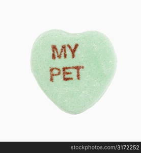 Green candy heart that reads my pet against white background.