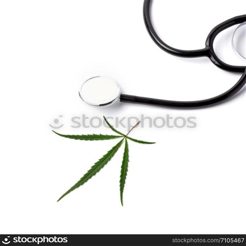 green cannabis leaf and black stethoscope on a white background, alternative medicine concept