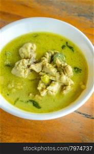 Green Chicken Curry in bowl on wooden background ,Thai cuisine
