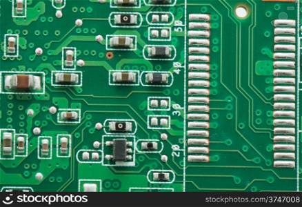Green circuit board with components