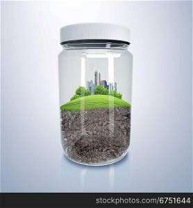 Green city on the hill inside a glass jar