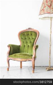 Green classical style Armchair sofa couch in vintage room with desk lamp