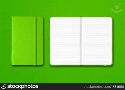 Green closed and open lined notebooks mockup isolated on colorful background. Green closed and open lined notebooks isolated on colorful background