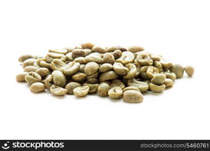 Green coffee beans heap isolated on white