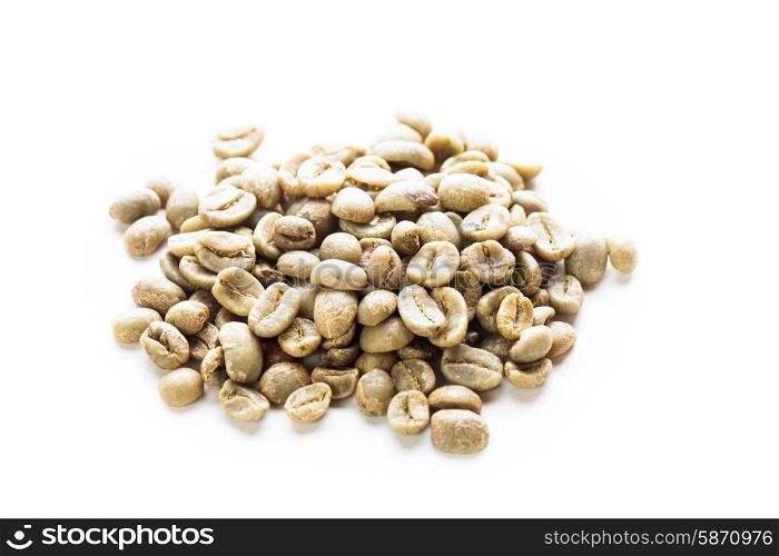 Green coffee beans heap isolated on white. green coffee