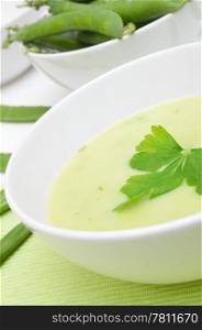 Green Creamy Pea Soup in White Bowl