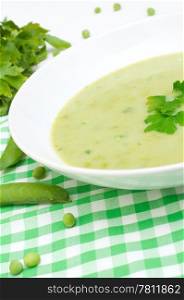 Green Creamy Pea Soup in White Plate