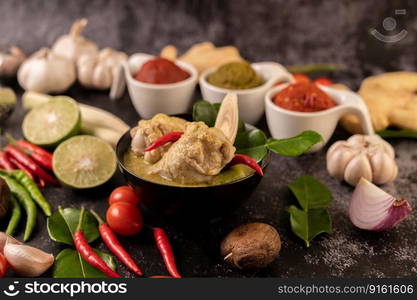 Green curry made with chicken, chili, and basil, with tomato, lime, kaffir lime leaves and garlic.