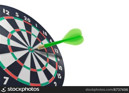 green dart hitting target center . isolated on white.