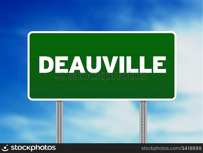 Green Deauville, Calvados, Normandie, France highway sign on Cloud Background.