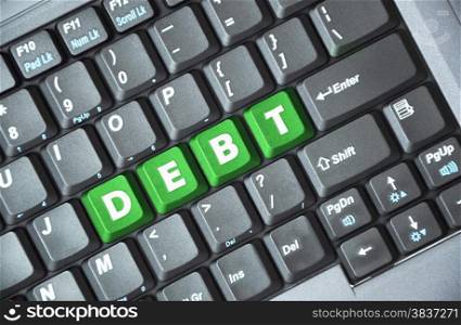 Green debt key on keyboard