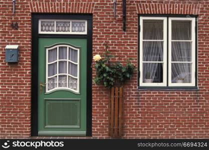 Green Door in Red Brick House