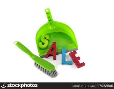green dustpan with sale text letters in red and blue