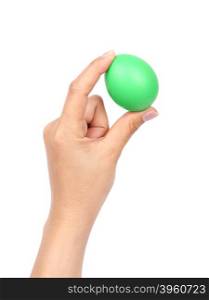 green easter egg in hand on white background