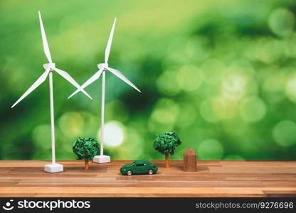 Green eco car and windmill turbine model with park on office table design. Sustainable and renewable clean solution with zero CO2 emission for green ecology and environmental concept. Alter