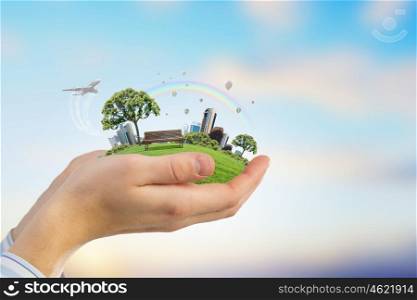 Green eco planet. Close up of hand holding green tree concept