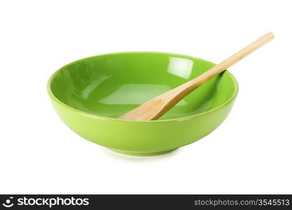 green empty ceramic bowl and wooden spoon isolated on white background