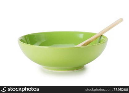 green empty ceramic bowl and wooden spoon isolated on white background