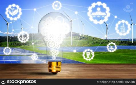 Green energy innovation light bulb with future industry of power generation icon graphic interface. Concept of sustainability development by alternative energy.
