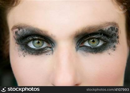 Green eyes woman, black makeup eye shadow macro