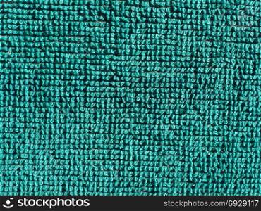 green fabric texture background. green fabric texture useful as a background