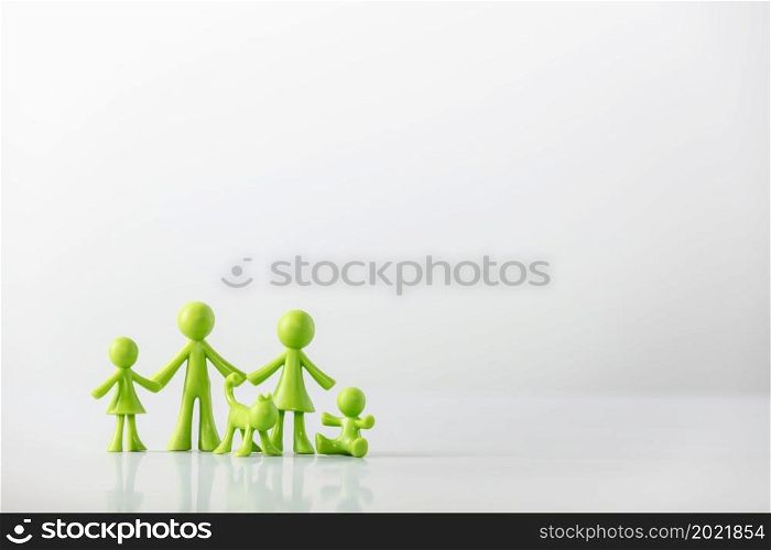 Green figures made of biodegradable plastic model of family with children - family relationship concept. Green figures made of biodegradable plastic model of family with children